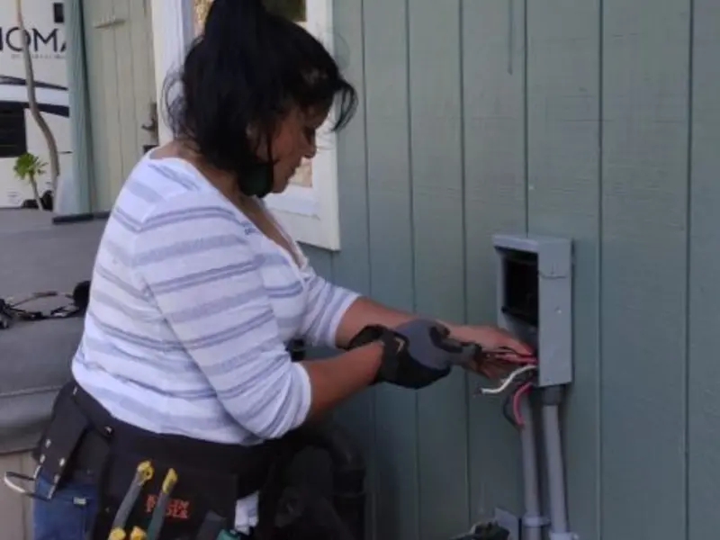 Licensed electrician wiring an exterior subpanel in Mattoon
